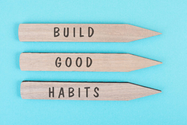 The words build good habits are standing on arrows, change lifestyle, healthy and positive attitude, motivation concept