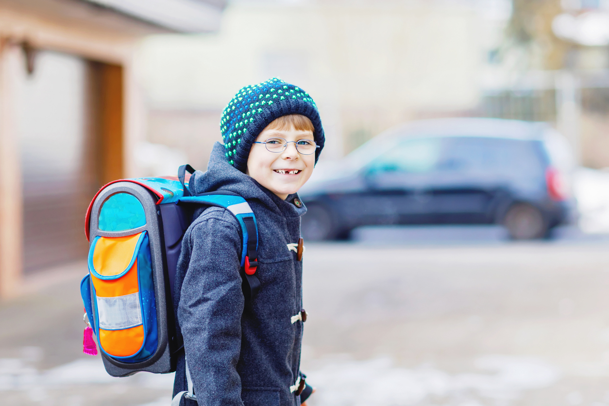 young boy going back to school in january.