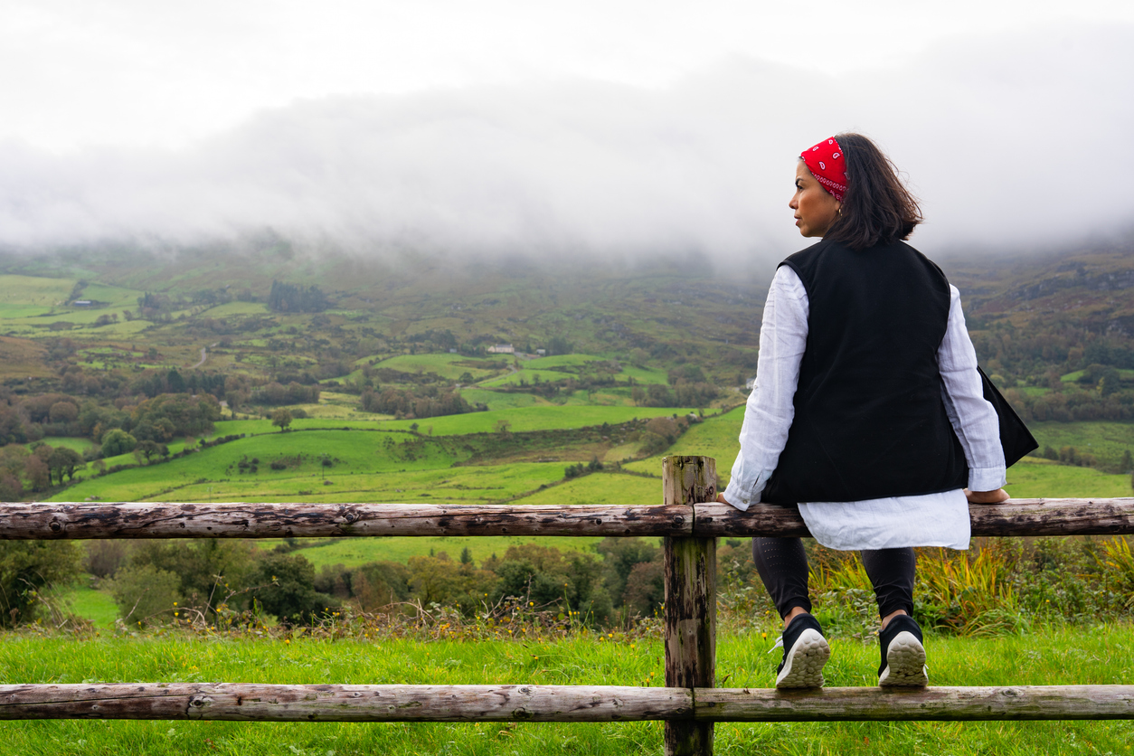 woman sitting outside after setting healthy boundaries.